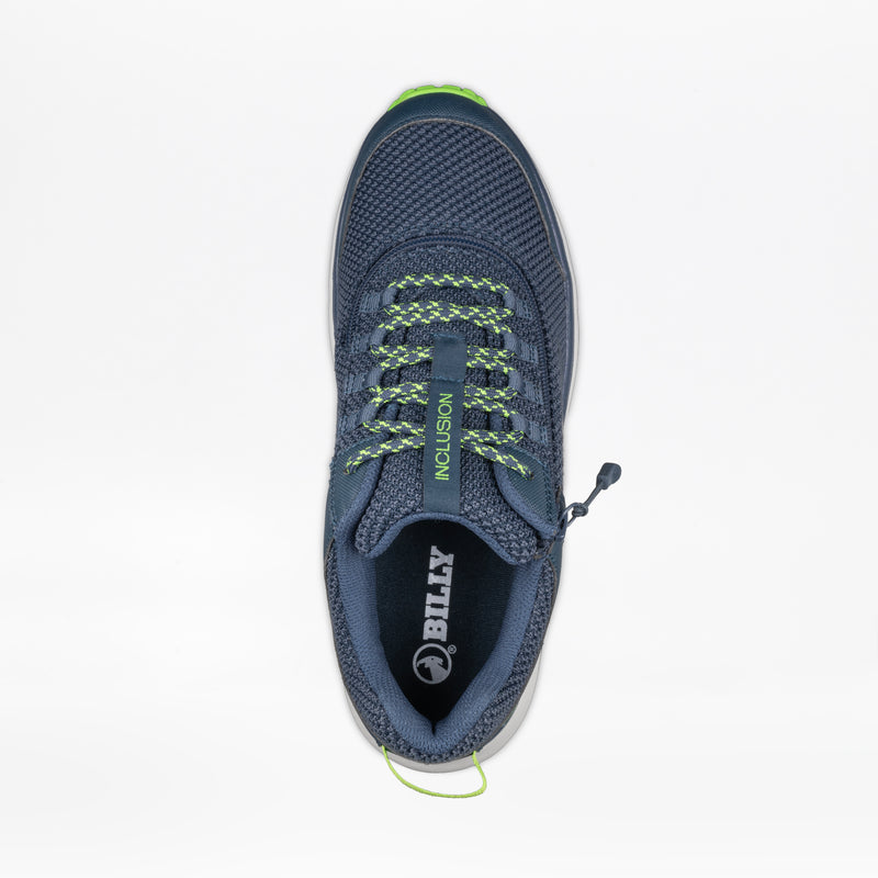 Top view of the Men's Navy/Green BILLY Inclusion Trail by BILLY Footwear, a slip-on trail shoe with green and gray laces, a green heel pull tab, "INCLUSION" on the tongue, and a white BILLY logo in the insole, displayed on a white background.