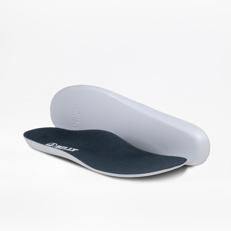 A pair of contoured Men's Navy/Green BILLY Inclusion Trail insoles from BILLY Footwear, featuring dark tops and white bottoms, are shown on a plain white background—one flat and one propped up behind it.
