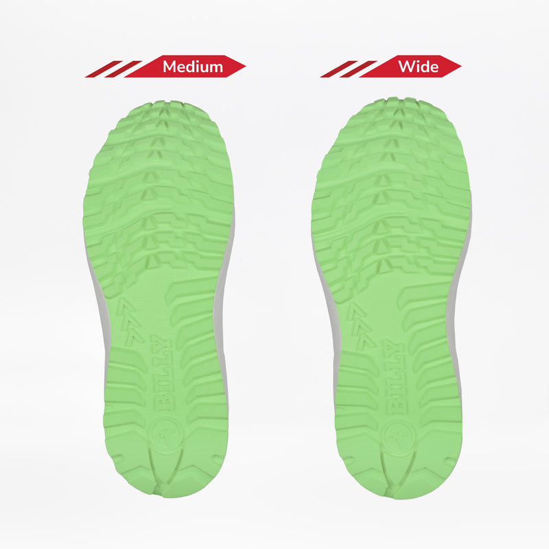 Two green soles from the Men's Navy/Green BILLY Inclusion Trail by BILLY Footwear are shown side by side on a white background. The left is labeled Medium and the right Wide, highlighting width variations in these trail shoes.