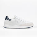 The Men's White/Navy BILLY Comfort Court by BILLY Footwear is a minimalist, low-cut white sneaker with a blue heel tab, white laces, and a white sole, shown in side profile on a white background.