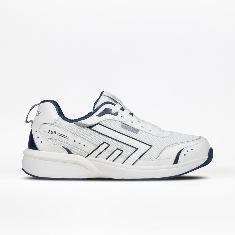 The Men's White/Navy BILLY Limitless 253 by BILLY Footwear is a white athletic sneaker with navy accents, mesh panels, geometric side patterns, a chunky sole, easy-on/easy-off design, and a heel pull tab.