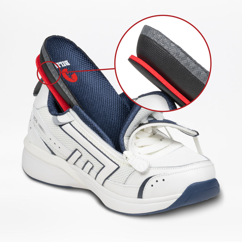The Men's White/Navy BILLY Limitless 253 by BILLY Footwear features an easy-on/easy-off design. Its partially opened structure reveals layered heel cushioning in black, red, and grey, highlighted in a magnified inset.