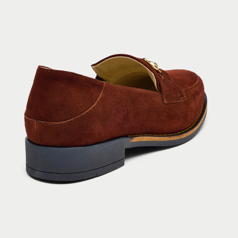 Brown suede loafer shoe on a light gray background