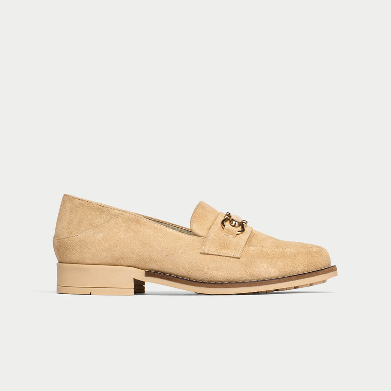 Beige loafer shoe on a light gray background