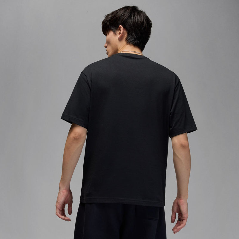Black men’s short-sleeve crewneck T-shirt shown from the back.