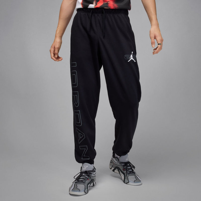 Black jogger sweatpants with vertical side wordmark print and small Jumpman logo