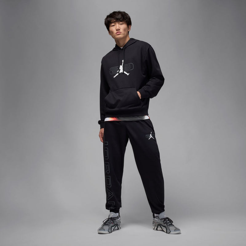 Black jogger pants with elastic cuffs and vertical side Jordan wordmark graphic