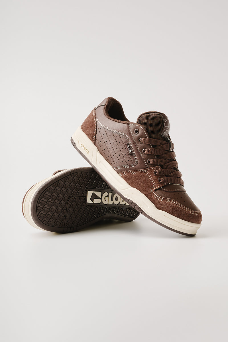 Studio shot of Mojo 2.0 Brown Antique sneakers stacked for display, showing side profile.
