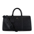 Black monogram duffel bag with top handles, front logo patch, and shoulder strap