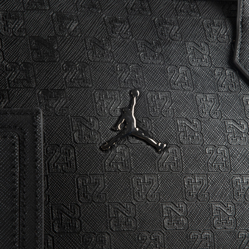 Black monogram tote bag front with embossed pattern and Jordan logo