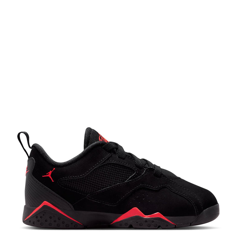 Kids black athletic sneakers with red trim, lace-up front and Jordan logo on side