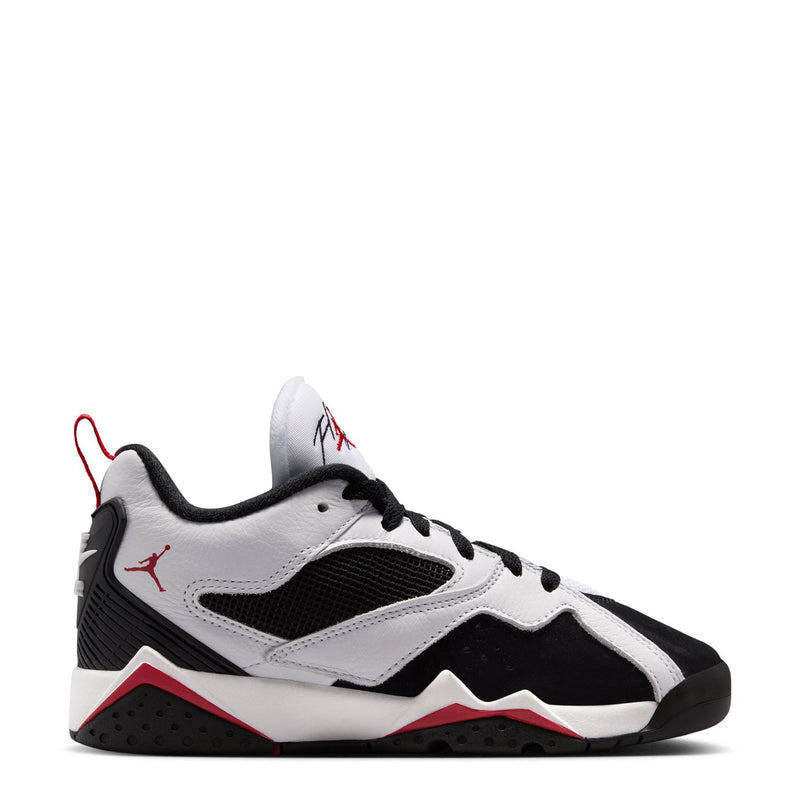 Youth basketball sneaker in white, black, and red with lace-up front and low profile sole