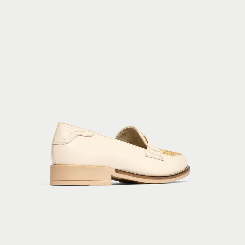 Beige loafer shoe on a white background