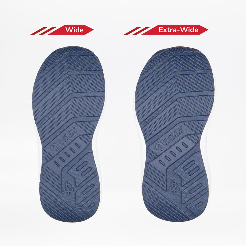 Two blue shoe soles from the Navy Floral BILLY Goat Classic High by BILLY Footwear are shown side by side. The left is labeled Wide, the right Extra-Wide, highlighting width differences for kids’ adaptive and AFO-friendly shoes.