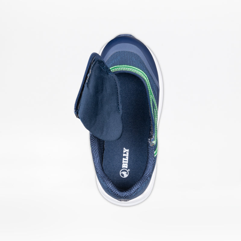 Top view of the Navy/Green BILLY Goat children’s sneaker by BILLY Footwear, featuring a white sole, green stripe, open hook-and-loop strap, “BILLY” branded insole and logo. AFO-friendly design for easy on-and-off wear.