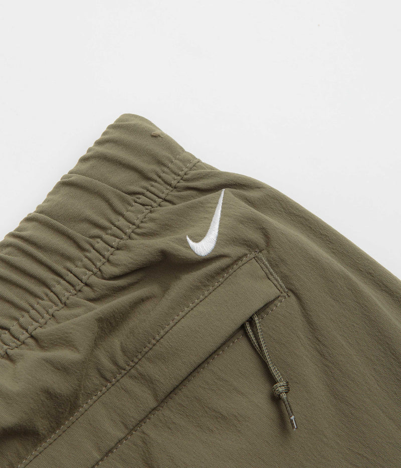 Nike ACG Hiking Pants in Medium Olive and Sequoia / Summit White