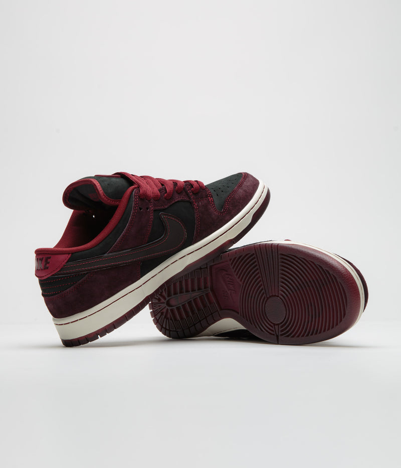 Nike SB x RIOT Skateshop Dunk Low Pro Shoes in Mahogany and Dark Beetroot and Team Red - Sail