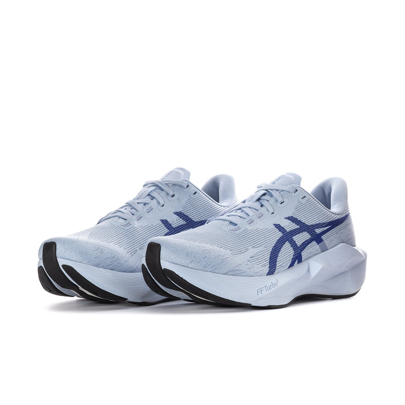 Pair of light blue knit running shoes with navy logo and cushioned midsole