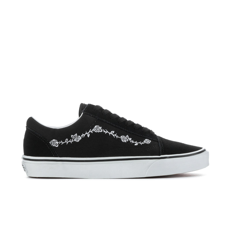 Men's black low-top sneakers with white floral side embroidery and white rubber sole