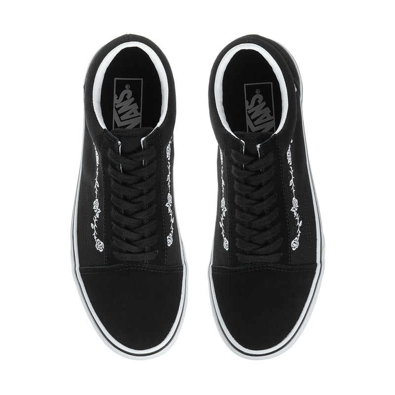 Men's black low-top sneakers, top view with black laces and Vans logo on tongue