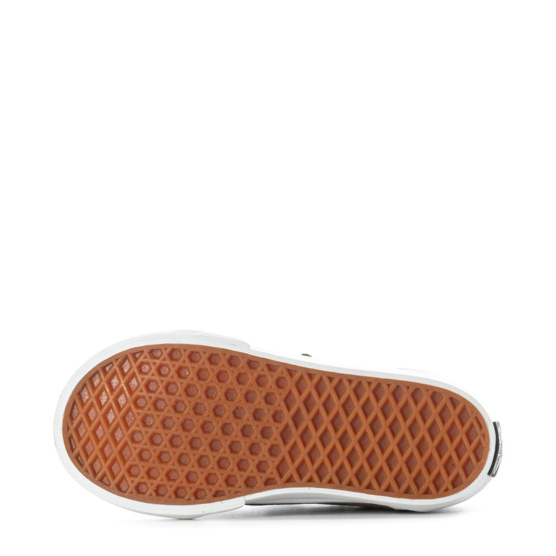 Toddler sneaker outsole with tan rubber tread and white sidewall