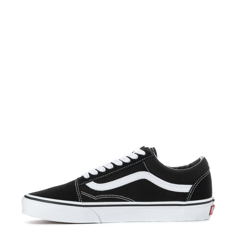 Black low-top sneakers with white side stripe, stitched details, and white laces
