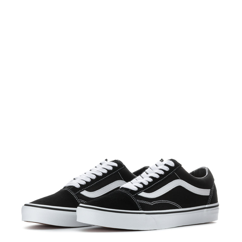 Pair of black low-top sneakers with white side stripes and white rubber cupsole