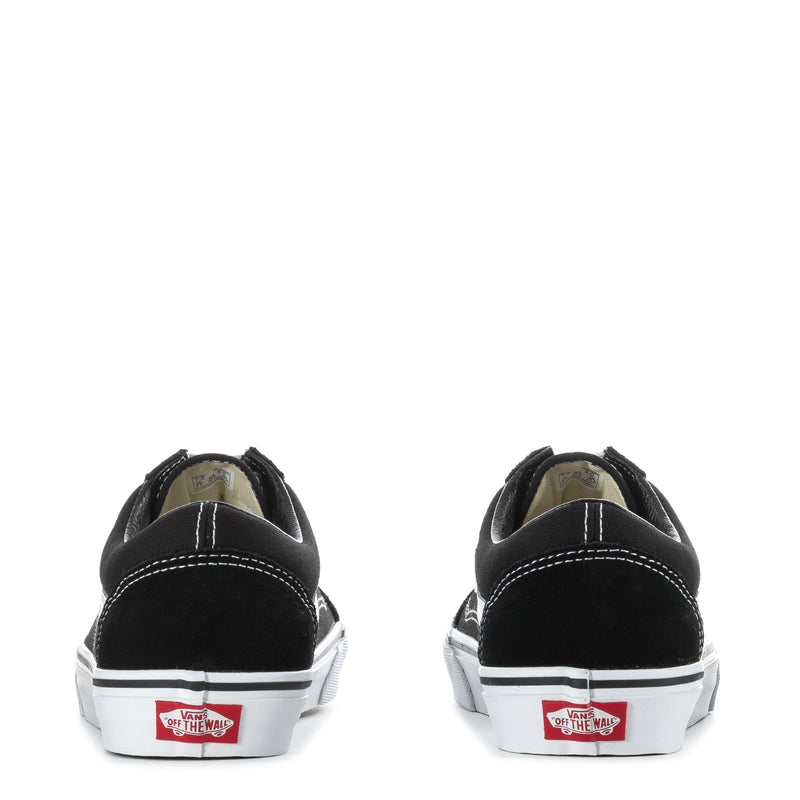 Black low-top sneakers with white heel tabs and white cupsole