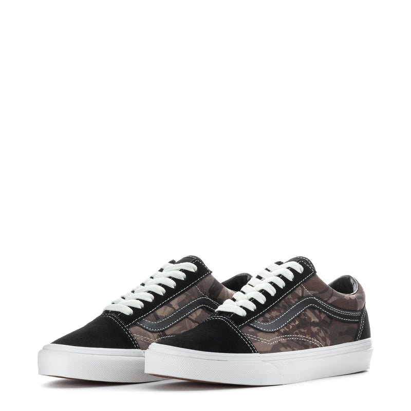 Pair of youth low-top sneakers, black with brown camo print, white lace-up
