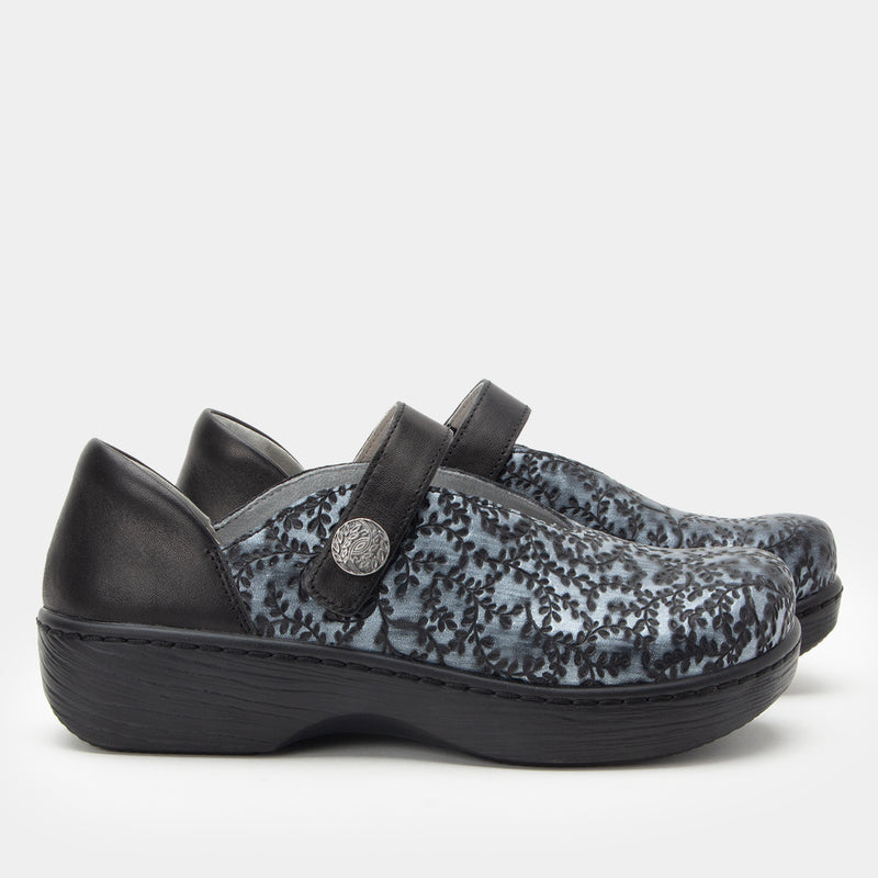 Opheliah Ivy Brush Silver mary-jane style shoe on a black Wood look rocker outsole.