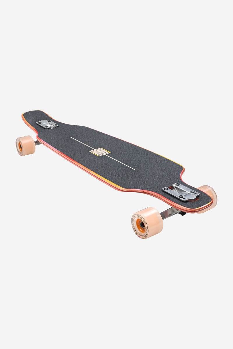 Top-down view of Outlier 36 inch Scorch longboard with gradient deck graphic and pale wheels