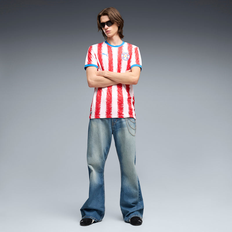 Men's home replica jersey with red vertical glitter stripes, blue neckline and sleeve trim