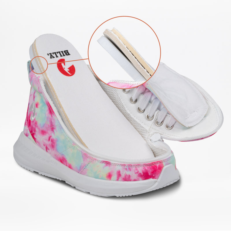 The Pink Watercolor BILLY Goat Classic High by BILLY Footwear showcases adaptive sneaker design with a partially lifted insole, revealing layered cushioning. An inset circle provides a close-up of the insole’s varied material layers.