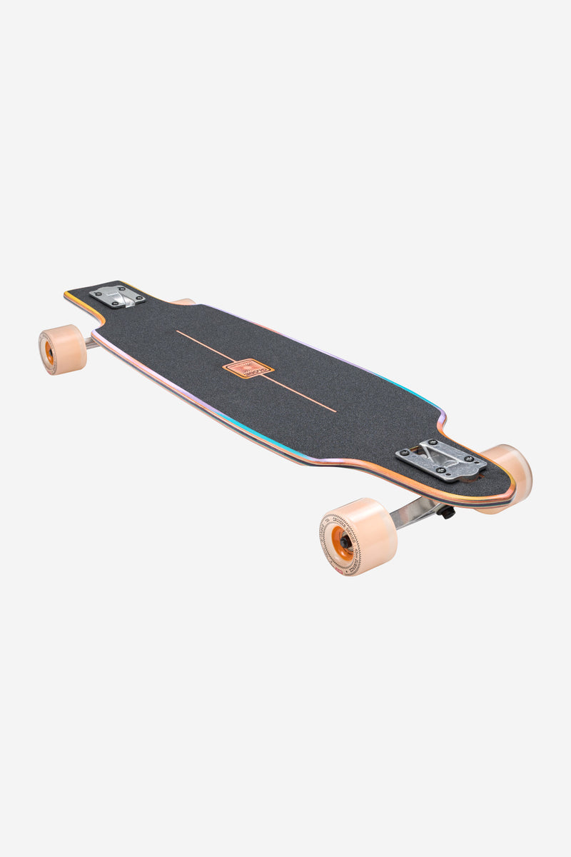 Prowler Mid 34 inch longboard Sunstone top view with black grip tape and colorful edge trim and tan wheels