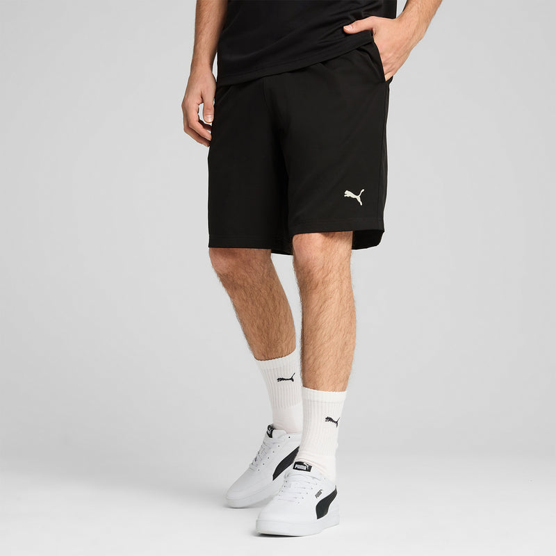 Black woven shorts with elastic waistband and PUMA logo on the side