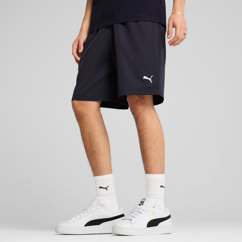 Navy woven mens shorts, elastic waist with Puma logo on the right leg.