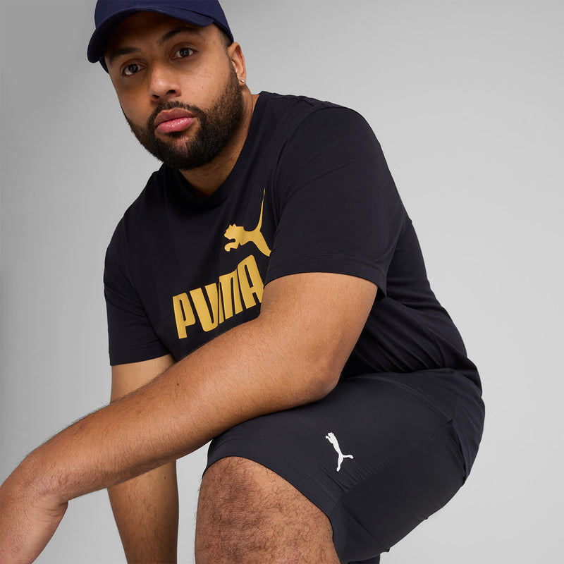 Navy Puma woven mens shorts close-up with Puma cat logo on the side.