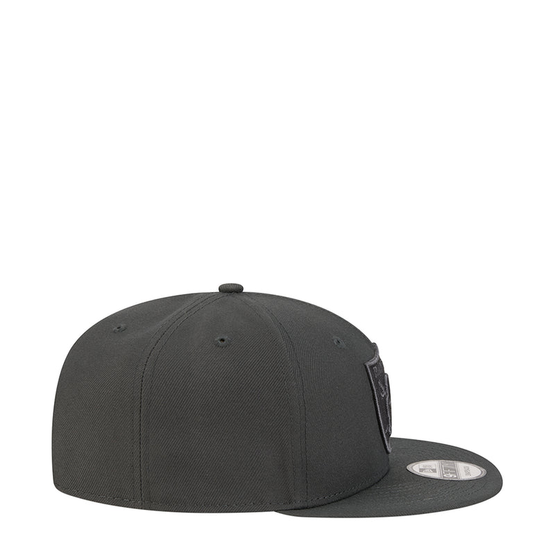 Dark gray Raiders baseball cap with side profile and tonal logo patch