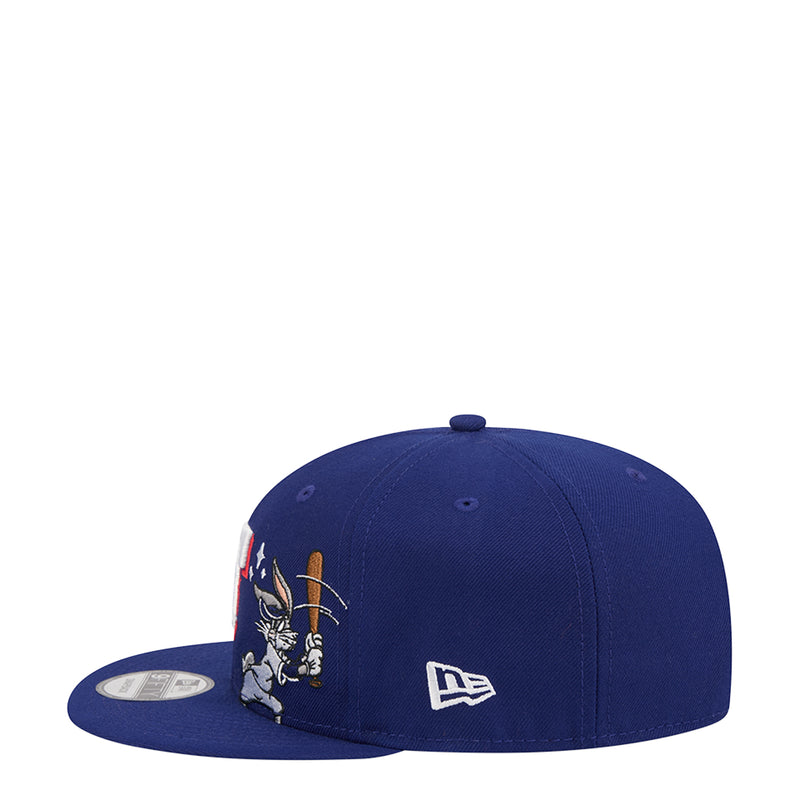 Blue baseball cap side with Bugs Bunny art and New Era flag logo