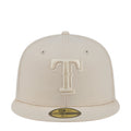 Light cream baseball cap with raised tonal T logo patch on front.