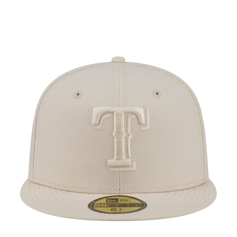 Light cream baseball cap with raised tonal T logo patch on front.