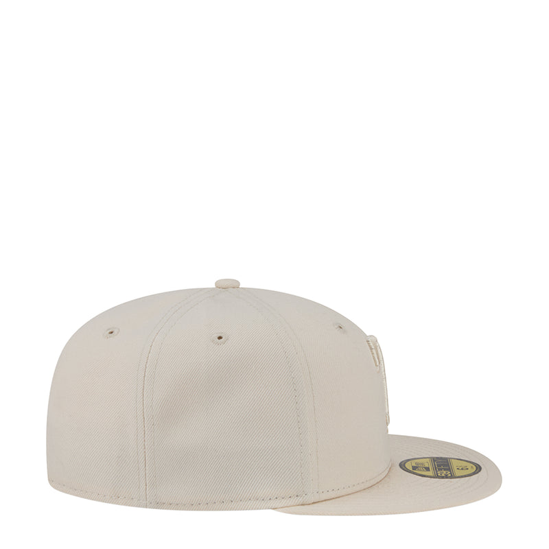 Light cream baseball cap, side view with curved brim and small eyelets.