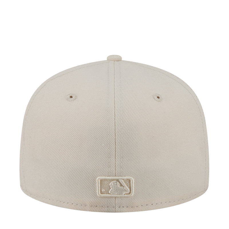 Light cream baseball cap with small tonal logo patch on back panel.