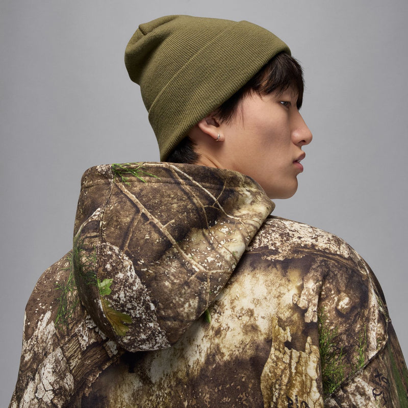 Men's camouflage pullover hoodie with hood up and detailed camo pattern