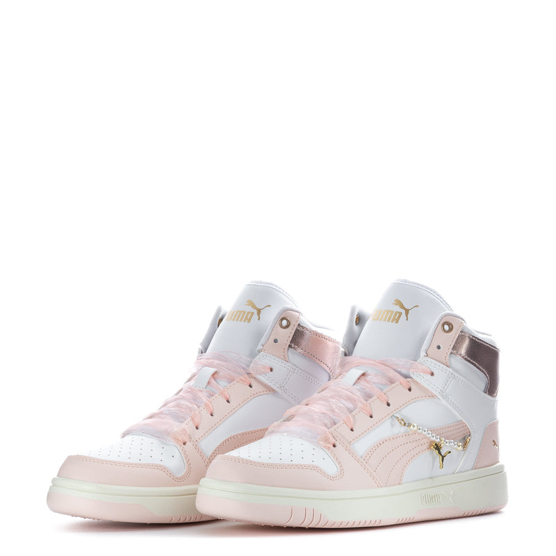 Pair of women’s high-top sneakers, white with blush accents and gold charm-style details