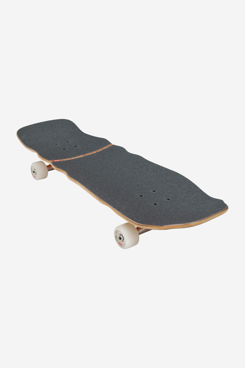 Top view of Restless Cruiserboard 10.0 Axe Man with dark grip tape and natural maple edge
