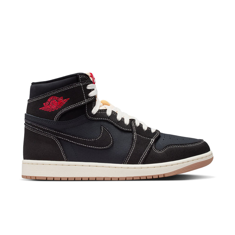 Black high-top sneakers with white sole, red accents, and lace-up design
