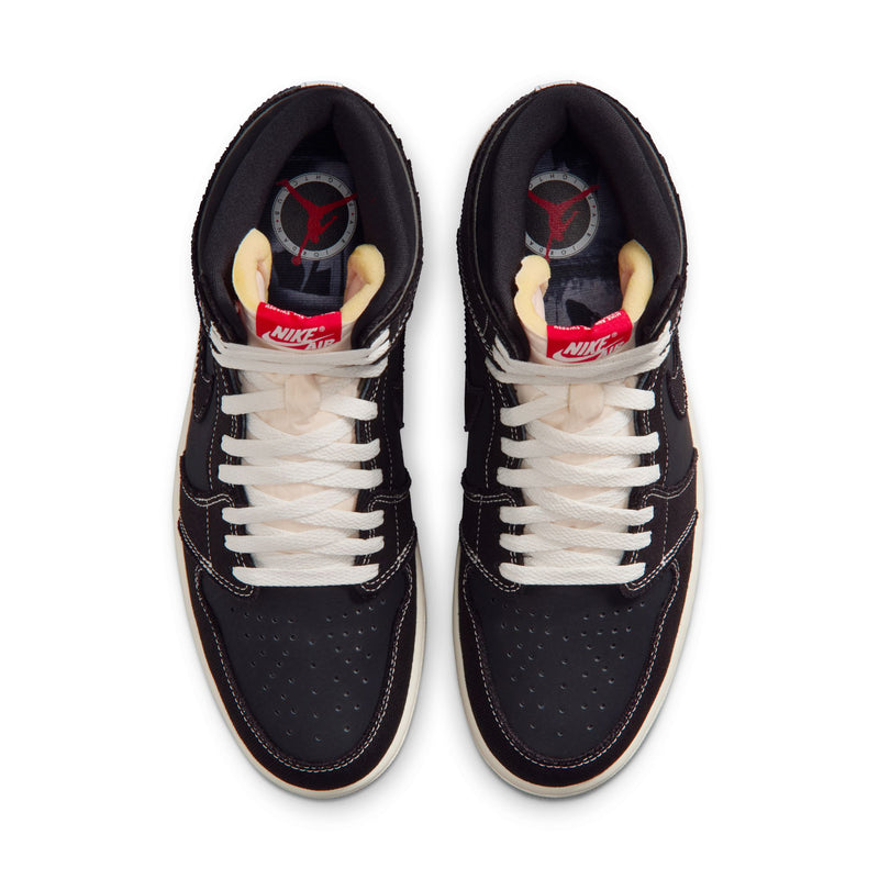 Pair of black high-top sneakers with white laces, showing inner lining details