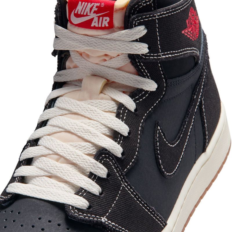 Close-up of black high-top sneakers with white laces, Nike Air tongue label