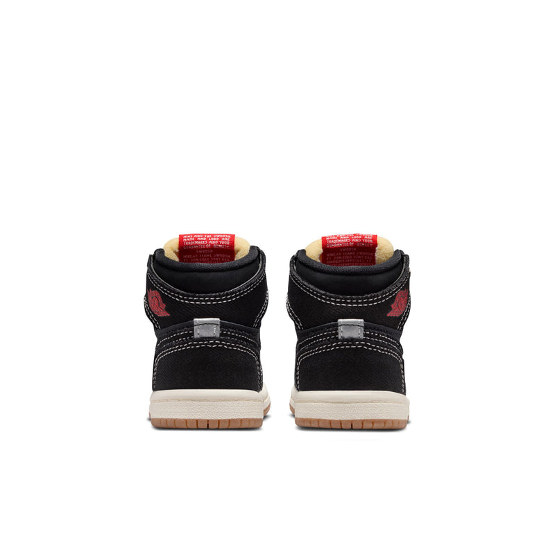 Toddler black high-top sneakers, heel view, with red patch and white stitching